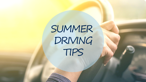 Steering wheel with woman's hand and text- Summer Driving Tips